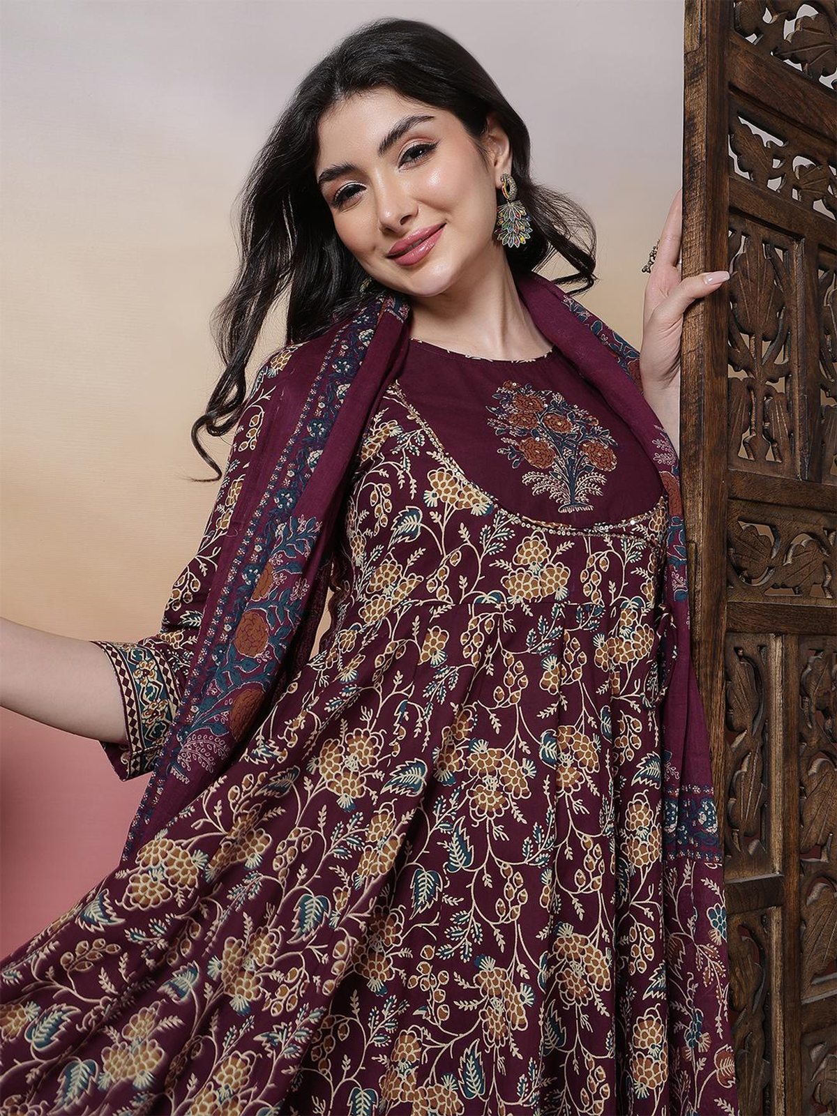 Wine printed Anarkali kurta set in cotton featuring intricate floral designs, perfect for festive occasions.