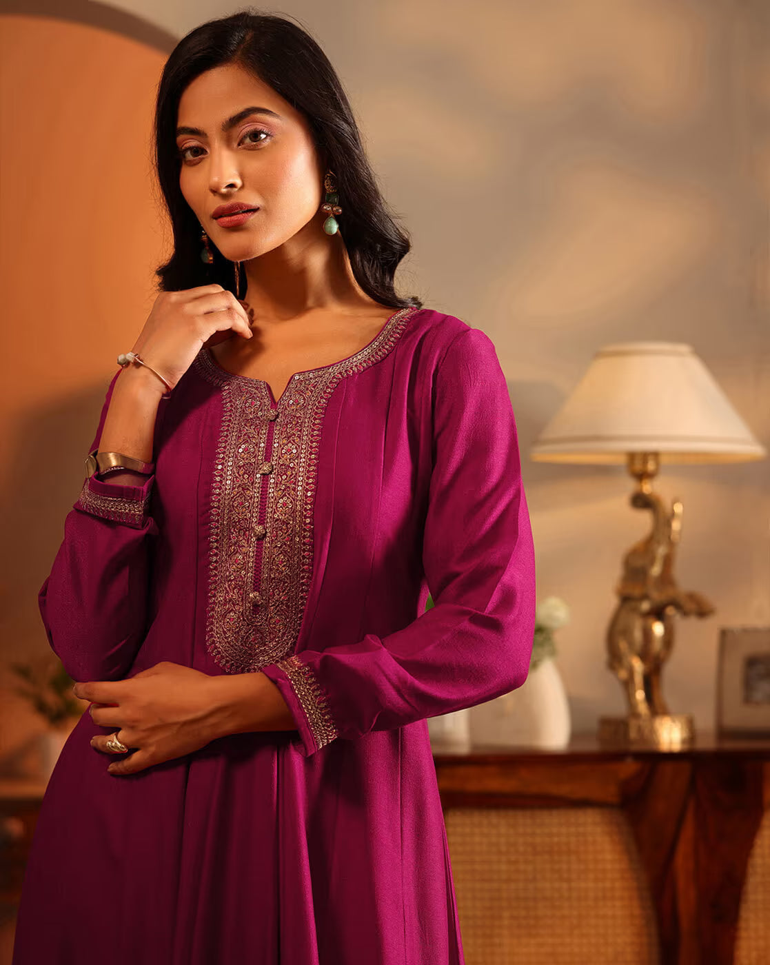 Women embroidered anarkali suit set in rich purple with intricate detailing and elegant design