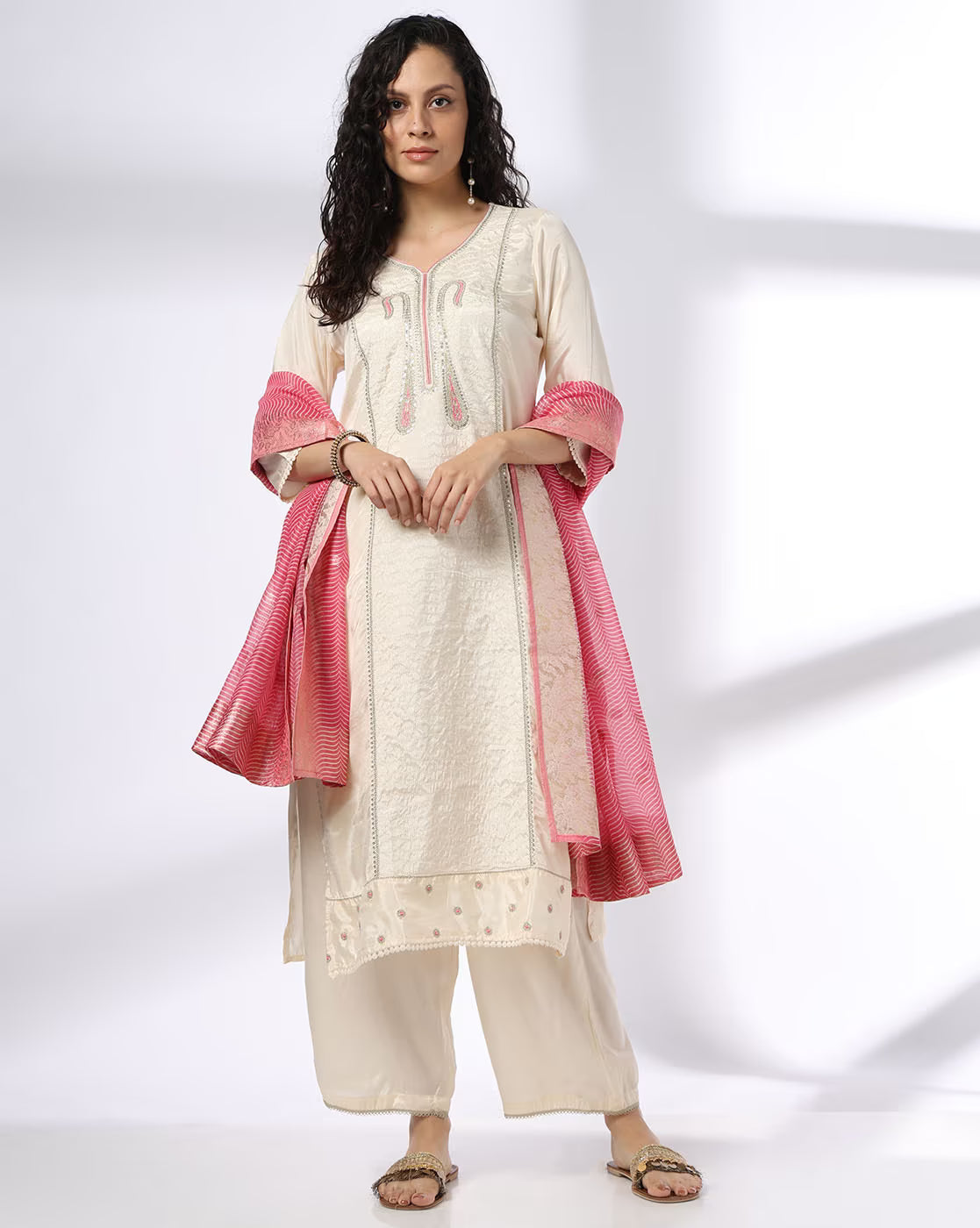 Elegant three piece embroidered kurta set for women with a pink dupatta and comfortable bottoms