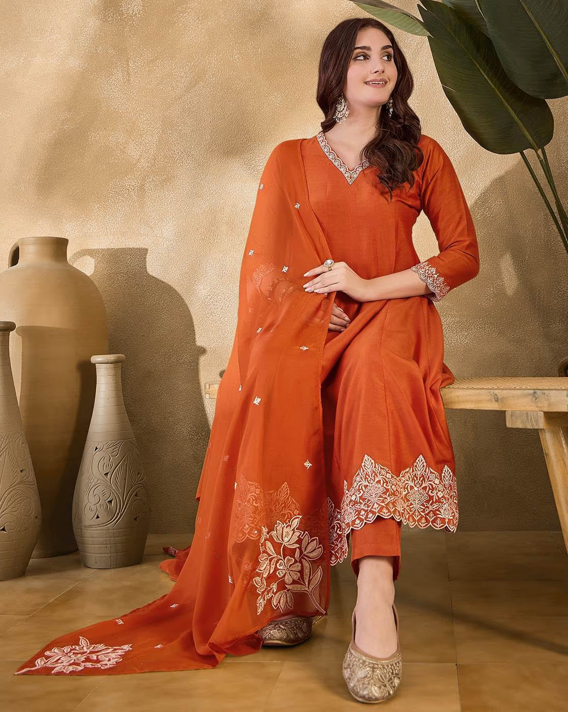 Aromie women v-neck a-line kurta suit set in orange with embroidered details and matching dupatta