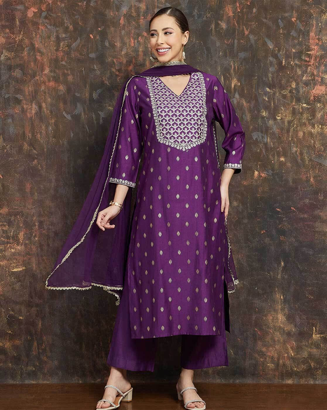 Women's embroidered kurta suit set in purple with detailed design and matching dupatta