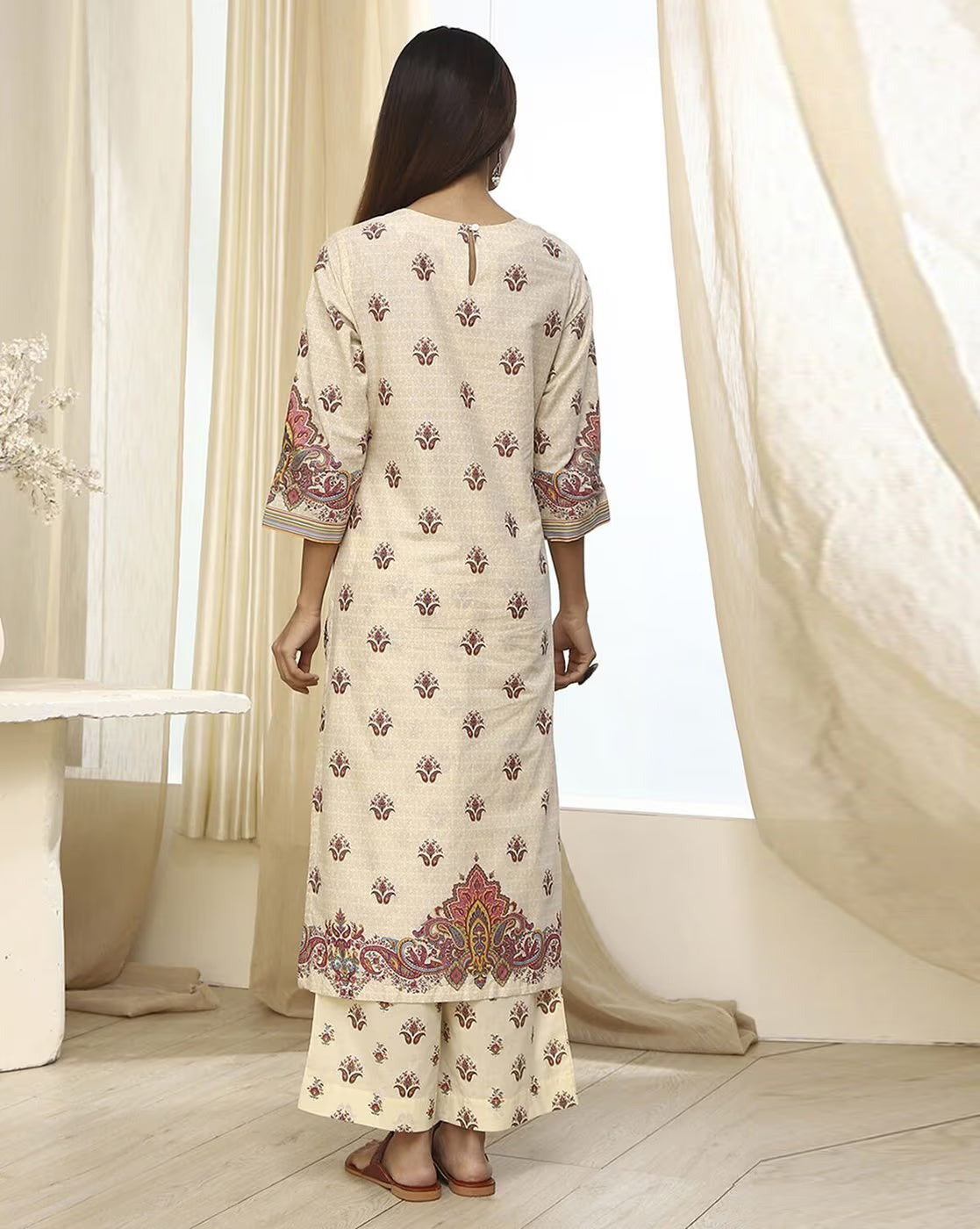 Back view of women's rayon kurta set by Aromie featuring intricate floral patterns and a comfortable fit