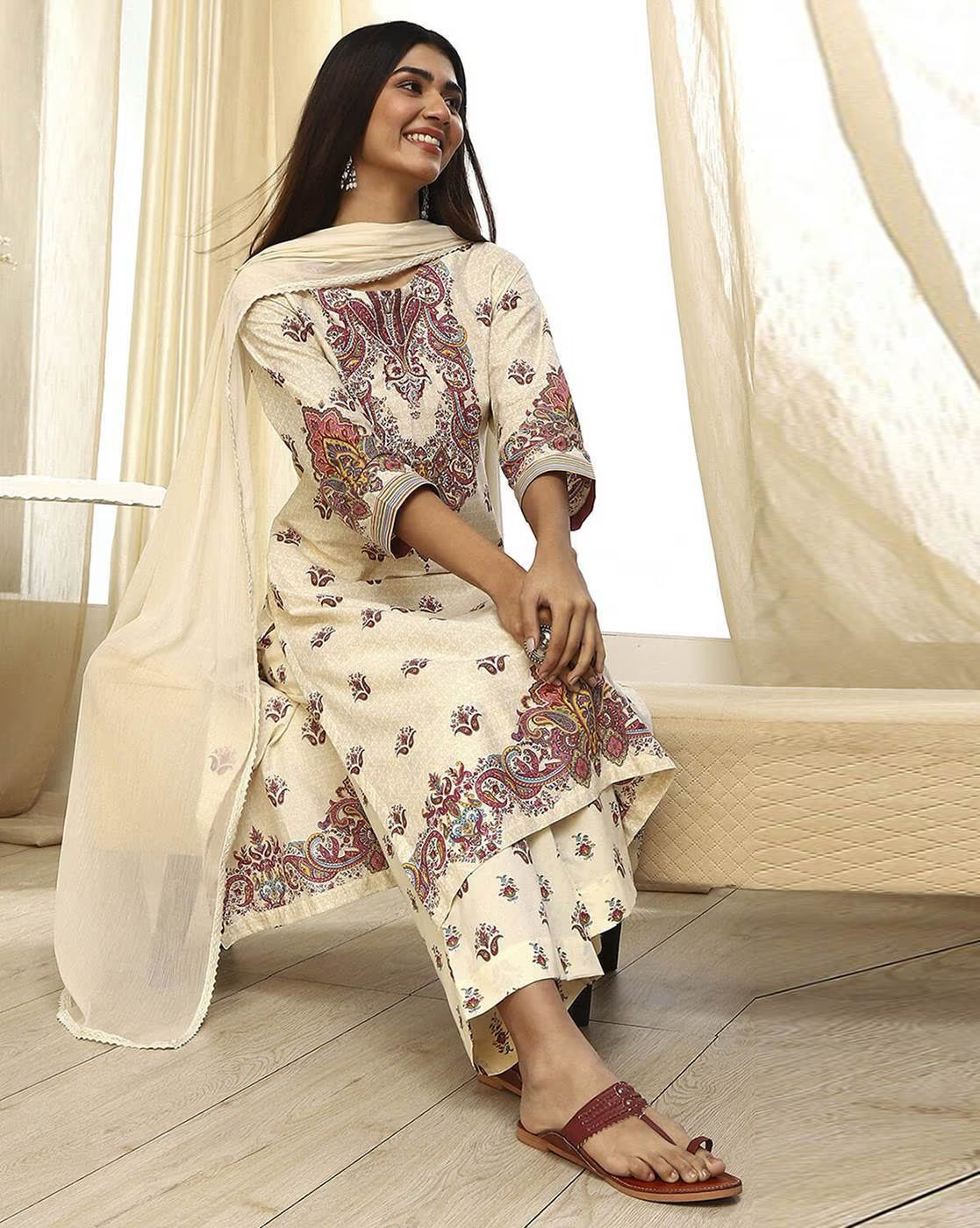Elegant women's rayon kurta set with intricate floral patterns, paired with a matching dupatta.