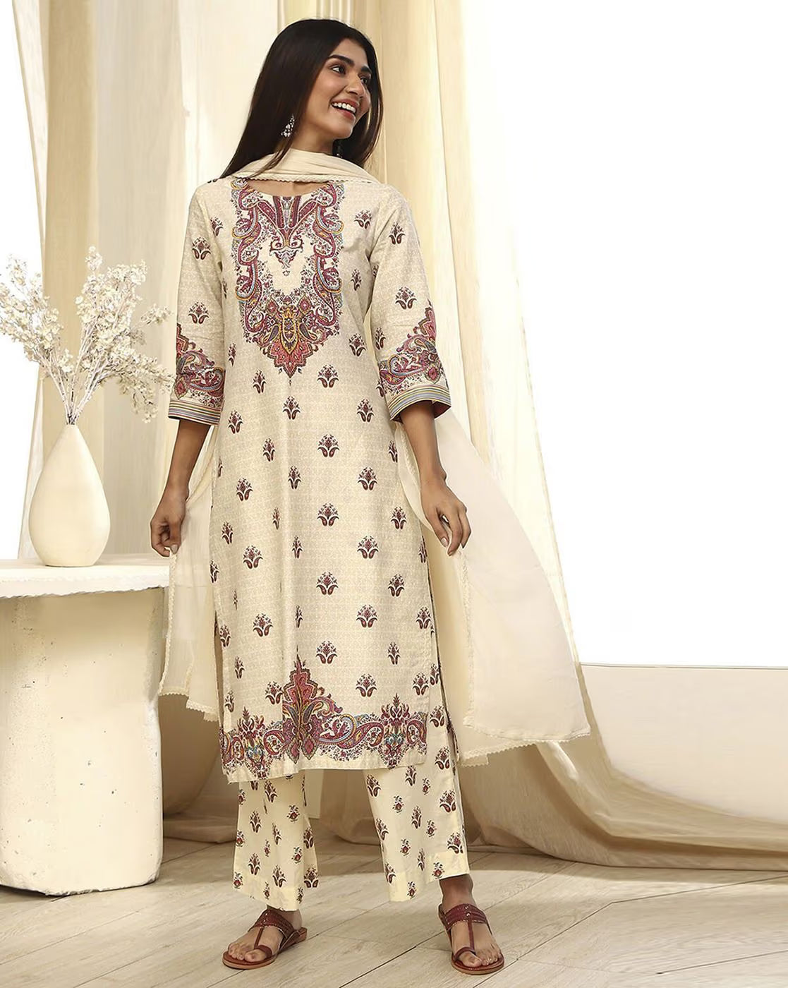 Elegant women's rayon kurta set featuring intricate floral designs and a matching palazzo with a lightweight dupatta