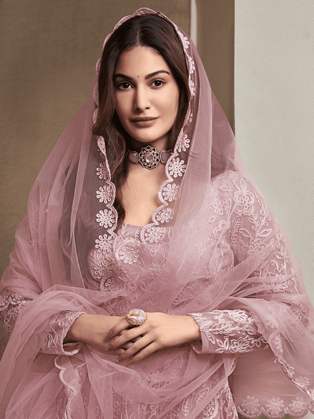 Elegant women's dress featuring Zari embroidery kurta set with intricate detailing and soft fabric