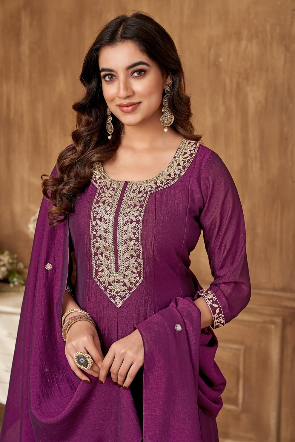 Elegant women's Zari embroidery kurta set in rich purple with intricate detailing and matching dupatta
